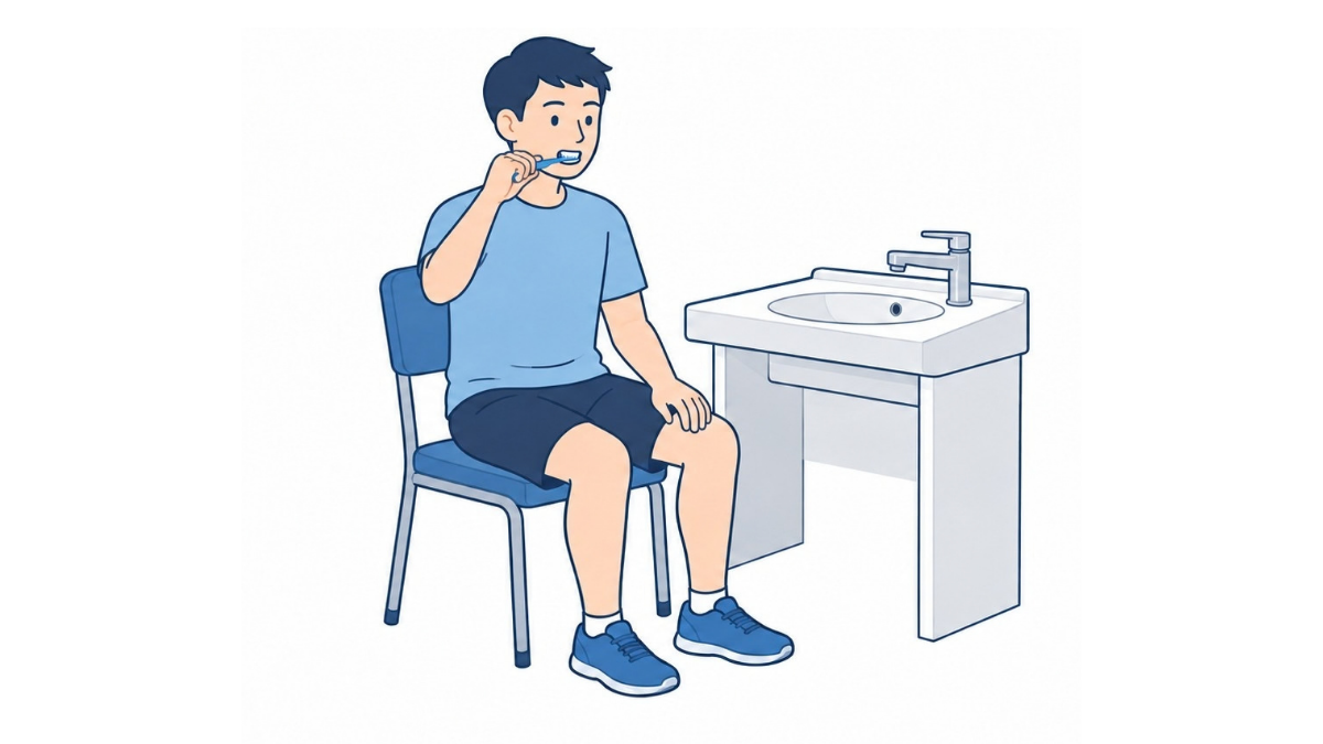 座って歯磨きのイラスト(文字なし)|洗面台の前の椅子に座り、歯ブラシで歯を磨く整容の場面です